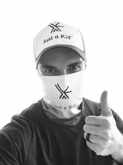 Model wearing JAK Black and White Baseball cap and Neck Gaiter